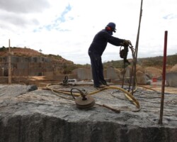 man harvesting stone